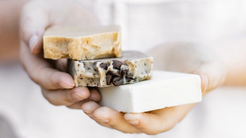 person holding brown and white chocolate bar